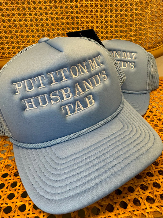 Put It On My Husbands Tab Trucker Hat